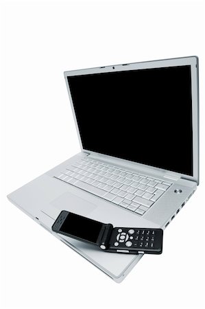 simsearch:400-04412834,k - Mobile phone on the keyboard of a laptop Stock Photo - Budget Royalty-Free & Subscription, Code: 400-05129973