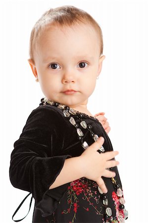 Portrait of a toddler in black dress with beads Foto de stock - Super Valor sin royalties y Suscripción, Código: 400-05129983