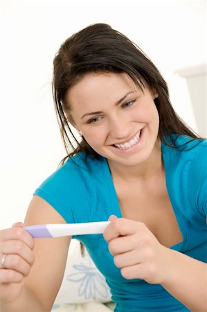 pregnant teen girl - Young Caucasian woman looking at pregnancy test Stock Photo - Budget Royalty-Free & Subscription, Code: 400-05120725