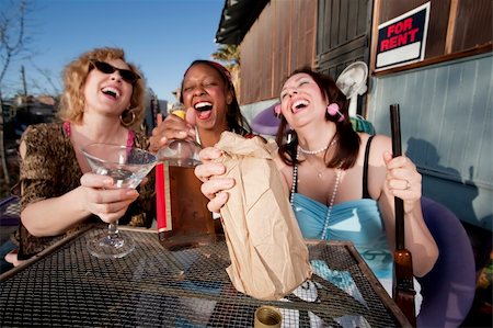 Three women outside a house drinking alcoholic beverages Stock Photo - Budget Royalty-Free & Subscription, Code: 400-05120776