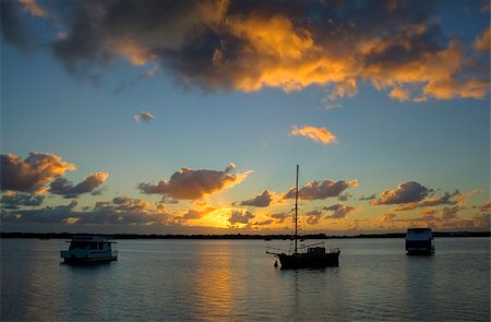 simsearch:400-05255037,k - Sunrise breaks over yacht and boats in the still of the morning. Stockbilder - Microstock & Abonnement, Bildnummer: 400-05120962