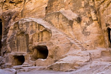 simsearch:400-05132743,k - Tombs in Little Petra - Nabataeans capital city (Al Khazneh) , Jordan. Made by digging a holes in the rocks. Roman Empire period. Photographie de stock - Aubaine LD & Abonnement, Code: 400-05121311