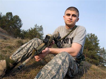 dragunov (artist) - USA Soldier having rest on the grass at the end of the day after a hard training or combat Stock Photo - Budget Royalty-Free & Subscription, Code: 400-05121400