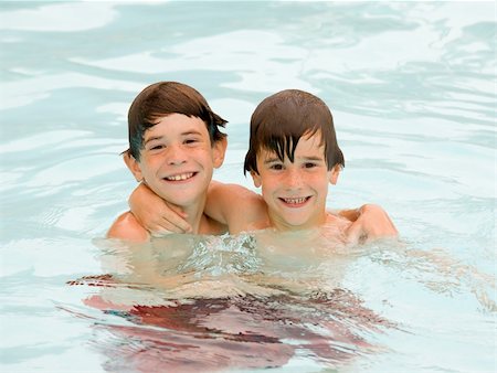 simsearch:400-05045912,k - Two Brothers Having a Fun Time Together at the Pool Stock Photo - Budget Royalty-Free & Subscription, Code: 400-05121436