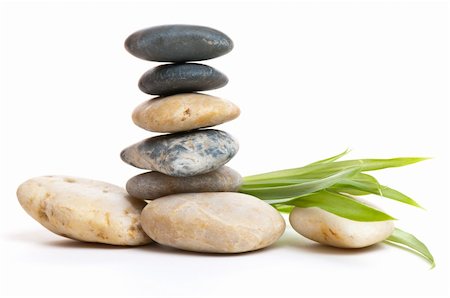 Stack of stones and some green leaves on the right. Very don't to earth and relaxed feeling. Stock Photo - Budget Royalty-Free & Subscription, Code: 400-05121638