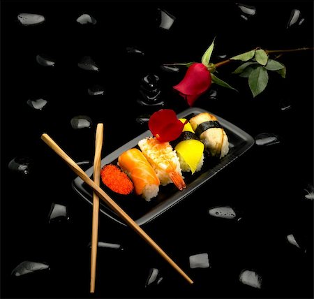 shrimp black - assorted sushi plate with red rose on black pebbles over black background Stock Photo - Budget Royalty-Free & Subscription, Code: 400-05121835