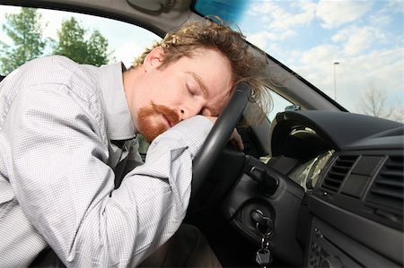 tired driver sleeps in a car Stock Photo - Budget Royalty-Free & Subscription, Code: 400-05122042