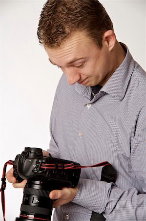 simsearch:400-04880707,k - A young man taking pictures Stock Photo - Budget Royalty-Free & Subscription, Code: 400-05122414