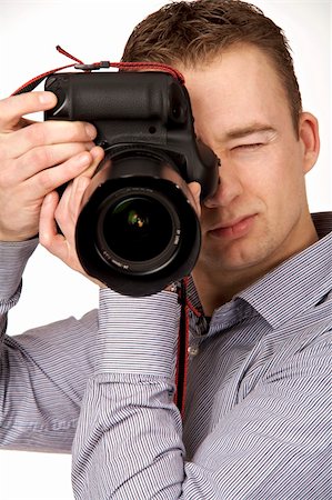 simsearch:400-04270950,k - A young man taking pictures Stockbilder - Microstock & Abonnement, Bildnummer: 400-05122417