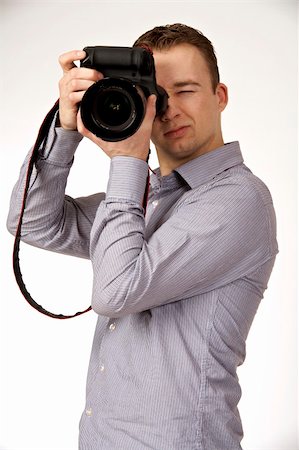 simsearch:400-04270950,k - A young man taking pictures Stockbilder - Microstock & Abonnement, Bildnummer: 400-05122419