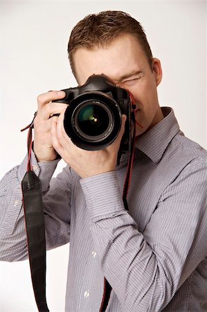 simsearch:400-04880707,k - A young man taking pictures Stock Photo - Budget Royalty-Free & Subscription, Code: 400-05122411