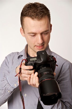 simsearch:400-04880707,k - A young man taking pictures Stock Photo - Budget Royalty-Free & Subscription, Code: 400-05122413