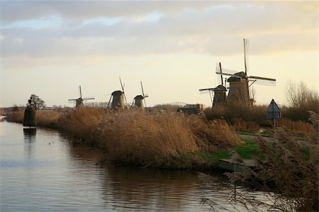 simsearch:400-05339966,k - Traditional Dutch pumps by sunset - old windmills in Kinderdijk, Netherlands. In 1997 these mills were put on the World Heritage List of UNESCO. Stock Photo - Budget Royalty-Free & Subscription, Code: 400-05122769