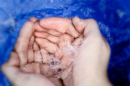 Macro image of water drops on a man hands Foto de stock - Super Valor sin royalties y Suscripción, Código: 400-05123500