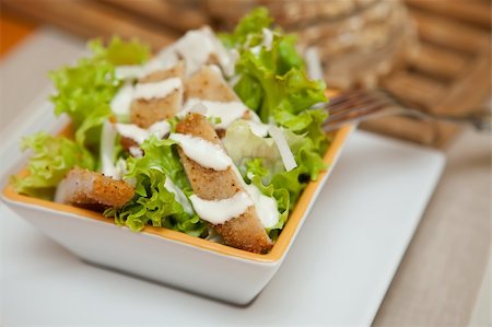 Premium caesar Salad with Crispy Chicken and onion Stock Photo - Budget Royalty-Free & Subscription, Code: 400-05134663