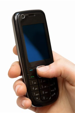 mobile phone in a hand on a white background Fotografie stock - Microstock e Abbonamento, Codice: 400-05134702