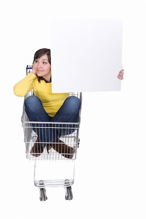 brunette woman with shopping cart. over white background Stock Photo - Budget Royalty-Free & Subscription, Code: 400-05134914