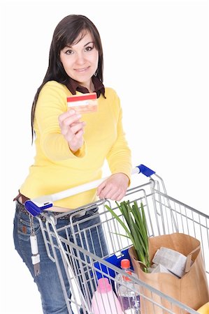 brunette woman with shopping cart. over white background Stock Photo - Budget Royalty-Free & Subscription, Code: 400-05134912