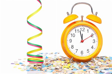 simsearch:400-05082002,k - Waiting the New Year with clock, confetti and ribbons. Shallow depth of field Photographie de stock - Aubaine LD & Abonnement, Code: 400-05134963