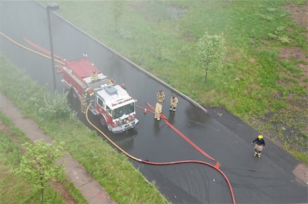 Fire engine shot from from above in the ladder truck with smoke Photographie de stock - Aubaine LD & Abonnement, Code: 400-05135146