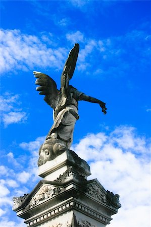 Stone Angel with blue sky and clouds in background Stock Photo - Budget Royalty-Free & Subscription, Code: 400-05135419