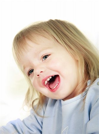 smiling toddler girl over white portrait Stock Photo - Budget Royalty-Free & Subscription, Code: 400-05135879