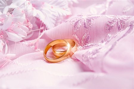 rashevskaya (artist) - Wedding background with pink decoration accessories and artificial golden rings Foto de stock - Royalty-Free Super Valor e Assinatura, Número: 400-05136259