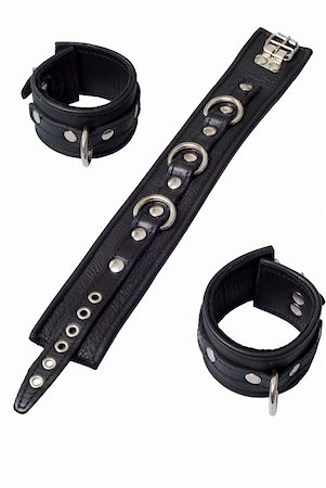 simsearch:695-05778698,k - Black Leather Collar with 3 rings, rivets and  Black Leather Locking Hand Cuffs on white background Photographie de stock - Aubaine LD & Abonnement, Code: 400-05136299