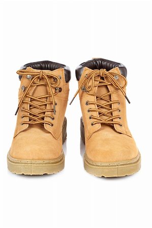 simsearch:400-04300535,k - A pair of hiking boots isolated on white background. Shallow depth of field Stock Photo - Budget Royalty-Free & Subscription, Code: 400-05136436