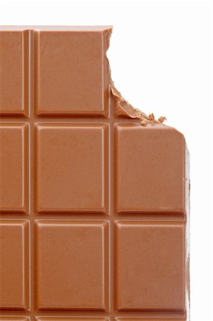 simsearch:400-05149272,k - Bitten chocolate bar isolated on white background. Shallow depth of field Stock Photo - Budget Royalty-Free & Subscription, Code: 400-05136453