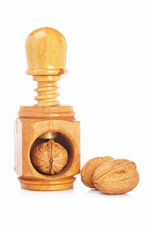 simsearch:400-04415203,k - Some walnuts and wood nutcracker reflected on white background Fotografie stock - Microstock e Abbonamento, Codice: 400-05136466