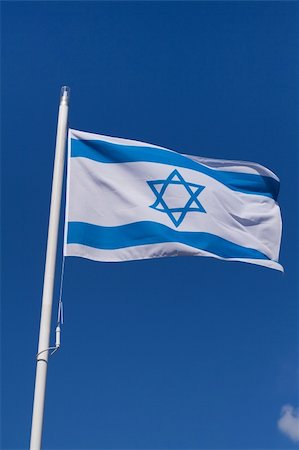 simsearch:400-05136582,k - Waving flag of Israel against the clear blue sky Stockbilder - Microstock & Abonnement, Bildnummer: 400-05136585