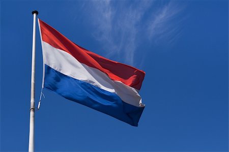 simsearch:400-05136582,k - Waving flag of The Netherlands against the clear blue sky Stockbilder - Microstock & Abonnement, Bildnummer: 400-05136590