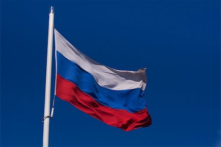 simsearch:400-05136582,k - Waving flag of Russian Federation against the clear blue sky Stockbilder - Microstock & Abonnement, Bildnummer: 400-05136591