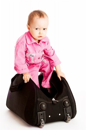 Baby stepping into the big black bag Photographie de stock - Aubaine LD & Abonnement, Code: 400-05136674