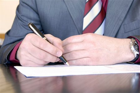 businessman hands on desk signing a document Stock Photo - Budget Royalty-Free & Subscription, Code: 400-05137517