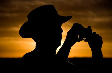 Cowboy silhouette at sunset in Grand Canyon Stock Photo - Budget Royalty-Free & Subscription, Code: 400-05138002