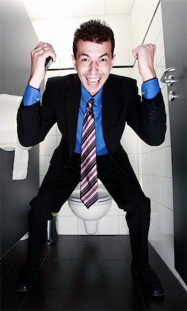 simsearch:400-04608943,k - happy businessman with tie standing in restroom Stock Photo - Budget Royalty-Free & Subscription, Code: 400-05138020