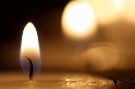 Candle burning with black background in shallow depth of field Stock Photo - Budget Royalty-Free & Subscription, Code: 400-05138366