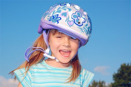 rollerblade girl - Four year old child wearing a protective helmet. Stock Photo - Budget Royalty-Free & Subscription, Code: 400-05138396