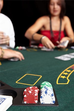 People playing cards, chips and players gambling around a green felt poker table. Shallow Depth of field Stock Photo - Budget Royalty-Free & Subscription, Code: 400-05138845