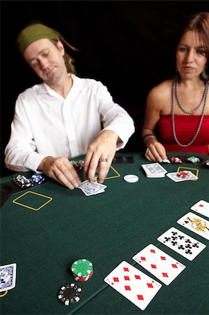 People playing cards, chips and players gambling around a green felt poker table. Shallow Depth of field Stock Photo - Budget Royalty-Free & Subscription, Code: 400-05138846