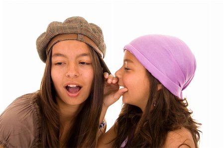 simsearch:400-03926791,k - Young girl telling a secret to another isolated on white Foto de stock - Super Valor sin royalties y Suscripción, Código: 400-05138908