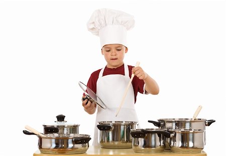 simsearch:400-04114221,k - Young kid dressed as a chef preparing a meal - isolated Stock Photo - Budget Royalty-Free & Subscription, Code: 400-05139094