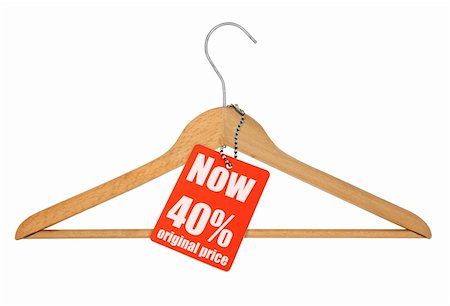 reduced sign in a shop - coat hanger and sale tag on white,  photo does not infringe any copyright Stock Photo - Budget Royalty-Free & Subscription, Code: 400-05139420