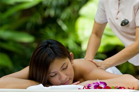 eastwestimaging (artist) - A beautiful young asian having massage outside in natural environment Fotografie stock - Microstock e Abbonamento, Codice: 400-05139791