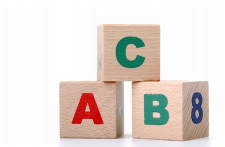 The alphabet. Letters drawn on wooden cubes. A children's toy Stock Photo - Budget Royalty-Free & Subscription, Code: 400-05130796