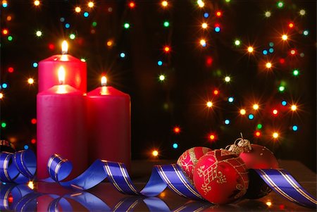 Christmas evening. A composition from candles, New Year's toys on a dark background Stock Photo - Budget Royalty-Free & Subscription, Code: 400-05130822