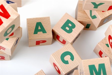early childhood education - The alphabet. Letters drawn on wooden cubes. A children's toy Photographie de stock - Aubaine LD & Abonnement, Code: 400-05130962