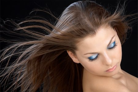simsearch:400-04679404,k - The beautiful girl with a flying hair on a black background Foto de stock - Royalty-Free Super Valor e Assinatura, Número: 400-05131640